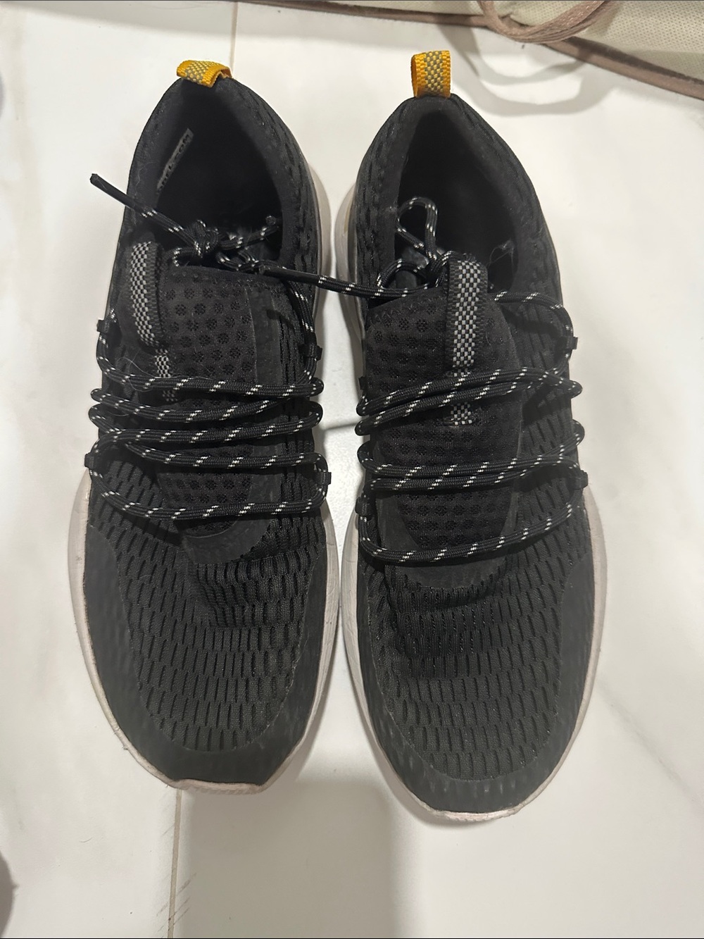 Sorel women's Black Athletic Knit Sneakers with Yellow Heel Tab